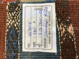 Cihanbeyli kilim age 100 measurements written on the label                        