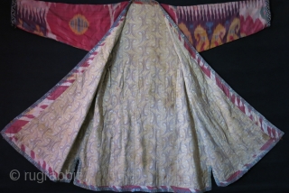 Uzbekistan Shoi - silk/ on silk quilted Chapan. Adras ikat facing and Printed cotton lining. very small minor holes in several places. Circa 1900 - size: Arm to arm 66" - 168  ...