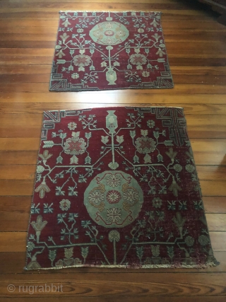 Pair of Khotan fragments, each 32" x 35", cut from a large early 19th c 3 medallion Tarim Basin carpet.
Condition good for age with areas of thinning. well saturated, compelling shale green  ...