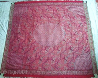 Square Moonshawl made in Kashmir (India) entirely kani woven in one piece . Its designs is composed of wavy branches on red ground with palms, scrolls and boteh.The moon and quarter moons  ...