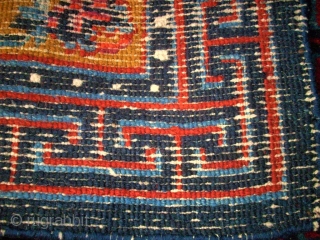 Pair of Tibetan / Chinese rugs. Size: 66 x 60 cm and 66 x 61 cm.                 