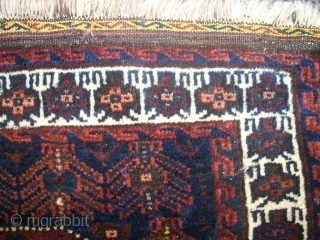 antique Baluch bagface. Size: 82 x 73 cm. Excellent wool. Fine knotting. Used. Some small repairs.                 