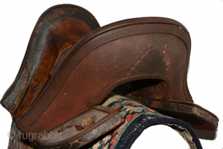 Tibetan wooden saddle with shagreen (the skin from a shark or stingray) decorating the front and back ‘faces’ and lower flat surfaces at either end. The rich grained wood has a beautiful  ...