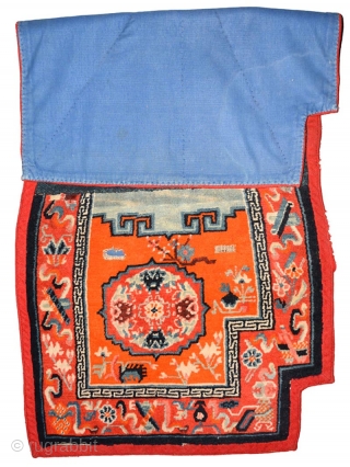 Tibetan under-saddle carpet or ‘makden’ joined (as is often the custom for this type of saddle carpet) in the center with a strip of naturally dyed blue nambu cloth and the back-side  ...