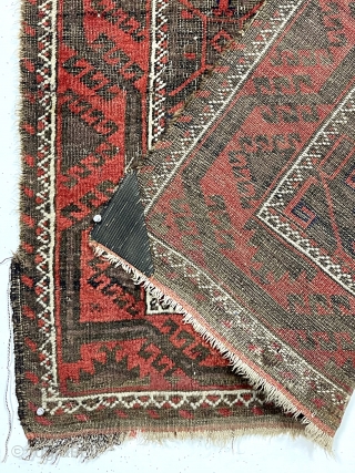 Antique little Baluch with classic tile design field. Interesting meandering vine border. All natural colors. Overall low pile with wear and brown oxidation as shown. Remnant original selvages and kelim ends. I  ...