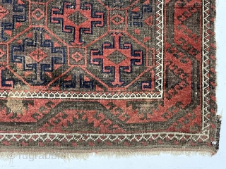Antique little Baluch with classic tile design field. Interesting meandering vine border. All natural colors. Overall low pile with wear and brown oxidation as shown. Remnant original selvages and kelim ends. I  ...