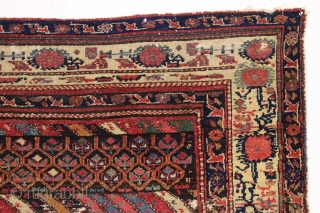 Large fragment of both ends of a beautiful old northwest Persian rug. Interesting design and all natural colors featuring a lovely old purple. Reasonably clean. ca. 1875. 4'4" x 5'10"   