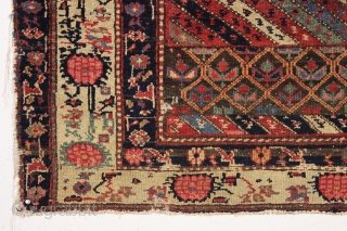 Large fragment of both ends of a beautiful old northwest Persian rug. Interesting design and all natural colors featuring a lovely old purple. Reasonably clean. ca. 1875. 4'4" x 5'10"   