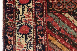 Large fragment of both ends of a beautiful old northwest Persian rug. Interesting design and all natural colors featuring a lovely old purple. Reasonably clean. ca. 1875. 4'4" x 5'10"   