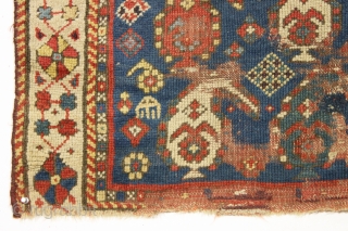 Antique little caucasian rug with an unusual border, unfortunately, ravaged by wolves. Interesting older piece, probably kazak. All natural colors featuring an unusually nice yellow. "as found". 3rd quarter 19th c. 2'8"  ...