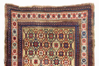 large yellow ground antique kazak or karrabaugh rug with a most unusual design feature. An inexplicable ivory panel woven into the rug as shown. When I first saw the rug I was  ...