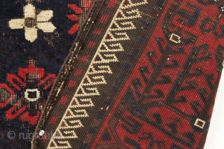 antique baluch rug with mina-hani design field. Characteristic older asymmetric flowers. All good natural colors with a nice ember red. Floppy handle with some scattered wear and heavy brown oxidation. Good age,  ...