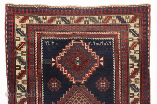 antique kazak or gendge rug with interesting inscriptions. Good thick medium length pile. All natural colors. "As found", very very dirty and with old moth nibbles (dinners) in the deep blue ground.  ...