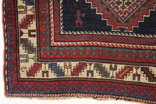 antique kazak or gendge rug with interesting inscriptions. Good thick medium length pile. All natural colors. "As found", very very dirty and with old moth nibbles (dinners) in the deep blue ground.  ...