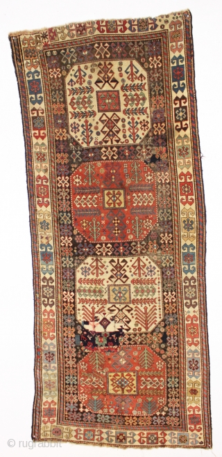 antique caucasian long rug, probably akstafa, with an interesting design featuring bold chajli type medallions. As found, with good fine weave and allover low pile, heavy brown oxidation, a few crude patch  ...