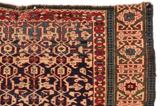 Antique caucasian Konaghend rug. Highest quality weaving. Possibly attacked by wolves. Thick glossy high pile but both end borders damaged. Numerous scattered chewed spots very crudely "repaired". All is not lost as  ...