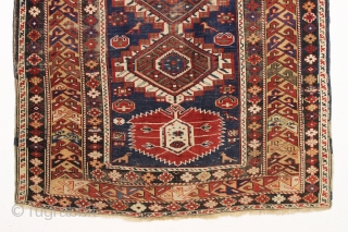 antique caucasian shirvan rug in fair condition for an older example. A karagashli variant with all natural colors featuring a pretty gold colored main border. Even low cut pile with scattered wear  ...