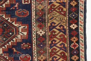 antique caucasian shirvan rug in fair condition for an older example. A karagashli variant with all natural colors featuring a pretty gold colored main border. Even low cut pile with scattered wear  ...