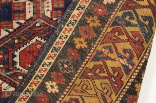 antique caucasian shirvan rug in fair condition for an older example. A karagashli variant with all natural colors featuring a pretty gold colored main border. Even low cut pile with scattered wear  ...