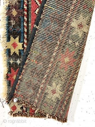 Antique little fragment of an older caucasian rug with beautiful old colors. Delicate drawing and deep brown oxidation. Lovely old purples, greens and yellows. Mid 19th c. 13” x 33”   