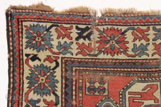 antique kazak rug with a wide "crab" border. All natural colors. As found, very dirty, with wear and some damage as shown but complete with original selvages. In need of at least  ...