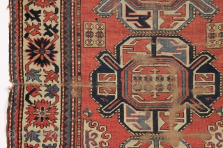 antique kazak rug with a wide "crab" border. All natural colors. As found, very dirty, with wear and some damage as shown but complete with original selvages. In need of at least  ...