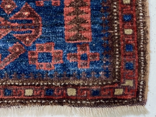 Antique unusual little blue ground Baluch bagface. A field design I have not encountered before along with an equally unusual border of hooked boxes.  Uncommon size more like a turkman mafrash.  ...