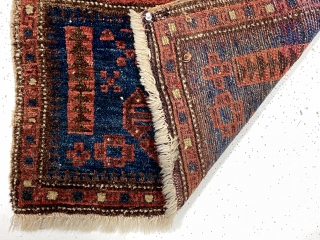 Antique unusual little blue ground Baluch bagface. A field design I have not encountered before along with an equally unusual border of hooked boxes.  Uncommon size more like a turkman mafrash.  ...