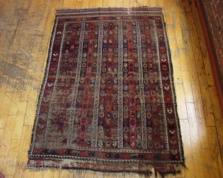 Antique Baluch rug. Interesting design. Rough condition. Unusual range of good natural colors. Has presence. 19th c. rug  4' 4" x 6' 7"         