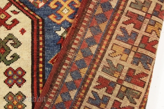 antique unusual karachopf kazak in good condition. Found in a New England barn. Beautiful large caucasian rug with all natural colors. Pretty tomato red ground with lots of light blue, richgreen and  ...