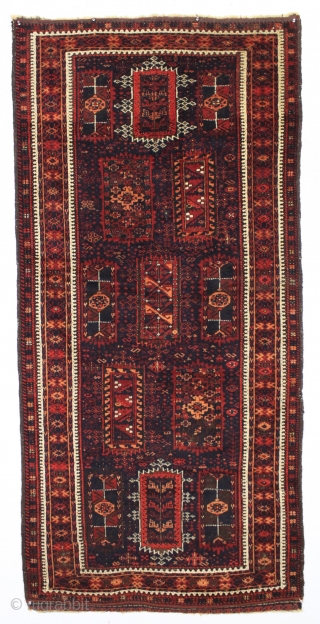 antique baluch rug with an interesting and unusual design in mostly thick high pile with a few knots of light colored silk in the border. Possibly a transitional piece with the drawing  ...