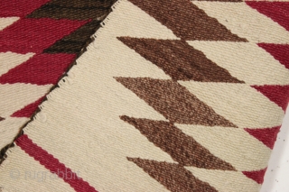 antique very small navajo rug or saddle blanket. As found this week, in very good condition, reasonably clean with no color run. Soft and supple. Interesting fancy selvage treatment. Pretty little jewel.  ...
