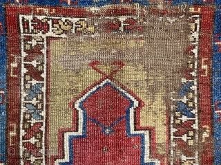 Antique Turkish village prayer rug. Early weaving ravaged by wolves. Priced accordingly. Mid 19th c. Or earlier. 3’2” x 4’3”             