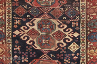 antique caucasian long rug in as found condition. An early example with unusual and elegant medallions. Beautiful border. All good natural colors. Soft and supple like cloth. A hard life with scattered  ...