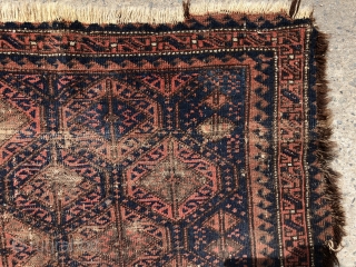 Antique Baluch bagface with classic lattice design. Older example in very worn condition and priced accordingly. Possibly of interest to someone focused on this type. All natural colors. As found in need  ...