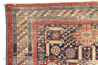 Strange remnant of an old shirvan rug with large areas of light blue cotton pile including most of the minor borders. Never seen anything quite like it before. Bad person cut rug.  ...