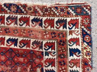 Early little Turkish rug. West Anatolian? Archaic design. Great border. Beautiful colors. Some decent pile but also heavy wear with holes as shown. Nearly square. Reasonably clean. One of my favorite little  ...