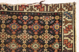 early northwest persian, or perhaps veramin rug remains. Not for everyone but to me a fascinating archaic field design with what I assume are cloudband derived motifs. Beautiful natural colors. As found,  ...