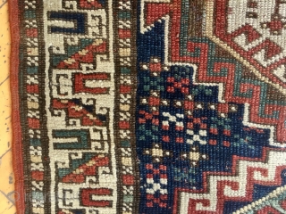 Antique kazak or Karabaugh rug. Interesting field. Fair condition. Even low pile. Good selvages. End loss as shown. Needs a wash. Charming little rug. Late 19th c. 3'3 x 5'5"   
