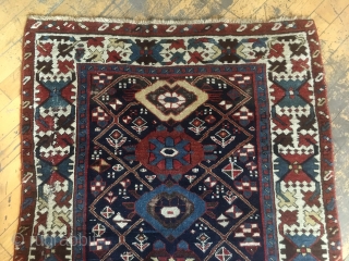 Antique long rug, possibly northwest Persian. Good quality rug in somewhat abused condition. Interesting field design and well drawn large scale  crab border. All natural colors. Large areas of wear, few  ...