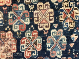 Early tribal rug fragment, probably northwest Persian with an interesting design featuring large memling guls and colorful endless knots. Add in many little animals and you have quite a charming weaving. All  ...