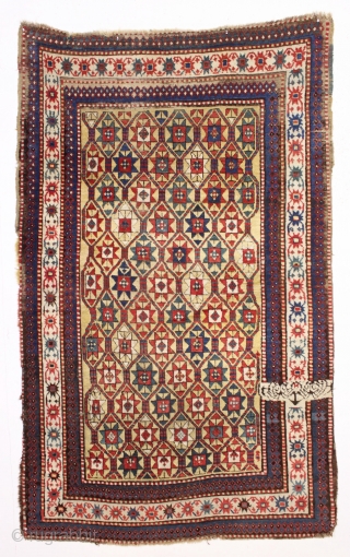 large yellow ground antique kazak rug with a unique design feature. A small ivory panel woven into the rug as shown. When i first saw the rug i was certain this was  ...