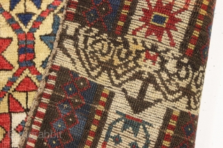 large yellow ground antique kazak rug with a unique design feature. A small ivory panel woven into the rug as shown. When i first saw the rug i was certain this was  ...