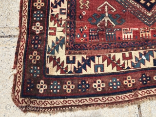 Antique Kazak rug fragment with a charming row of animals. Some decent pile. Some wear and brown oxidation. Edges all tattered. Reasonably clean. Offered for project or pillow? 19th c. 3’3” x  ...