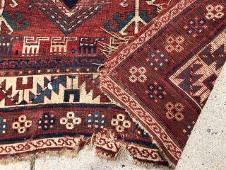 Antique Kazak rug fragment with a charming row of animals. Some decent pile. Some wear and brown oxidation. Edges all tattered. Reasonably clean. Offered for project or pillow? 19th c. 3’3” x  ...