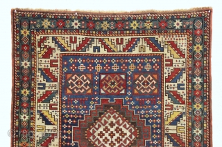 Antique kazak rug in good condition with lovely colors and charming folky drawing. Packed with weird and wonderful animals and their friends. All natural colors featuring nice old greens, clear yellows and  ...