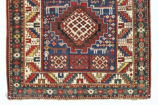 Antique kazak rug in good condition with lovely colors and charming folky drawing. Packed with weird and wonderful animals and their friends. All natural colors featuring nice old greens, clear yellows and  ...