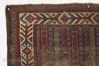 early little baluch rug with an unusual field design and colorful "fish bone" border generally found on older bagfaces. Turkish knotted. Abused and damaged but perhaps of interest to the baluch collector.  ...