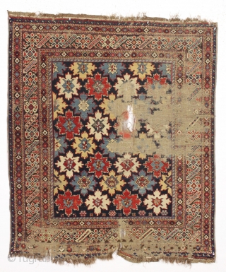 Antique east caucasian snowflake design rug, probabaly shirvan, with a nicely drawn chi chi border. High quality wool and all excellent natural colors. "As found" with damage as shown and priced accordingly.  ...