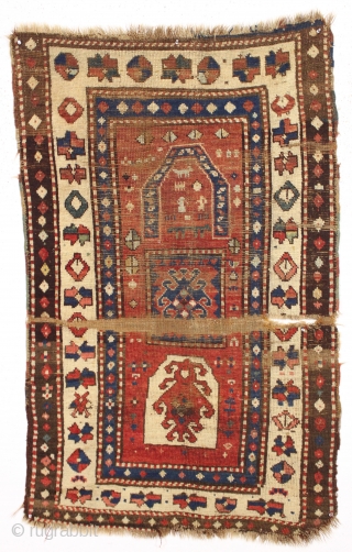 One of the most archaic and powerful little kazak or Karrabaugh prayer rug I have had. Right up there in rough condition as well. Very coarse weave. All good colors. Recently washed.  ...